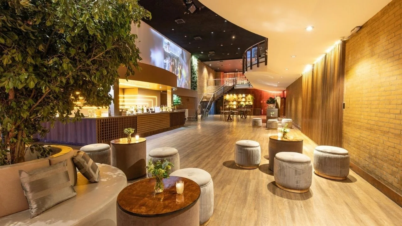 Forbes Fab Luxe lounge and entertainment area with bar counter and plush seating